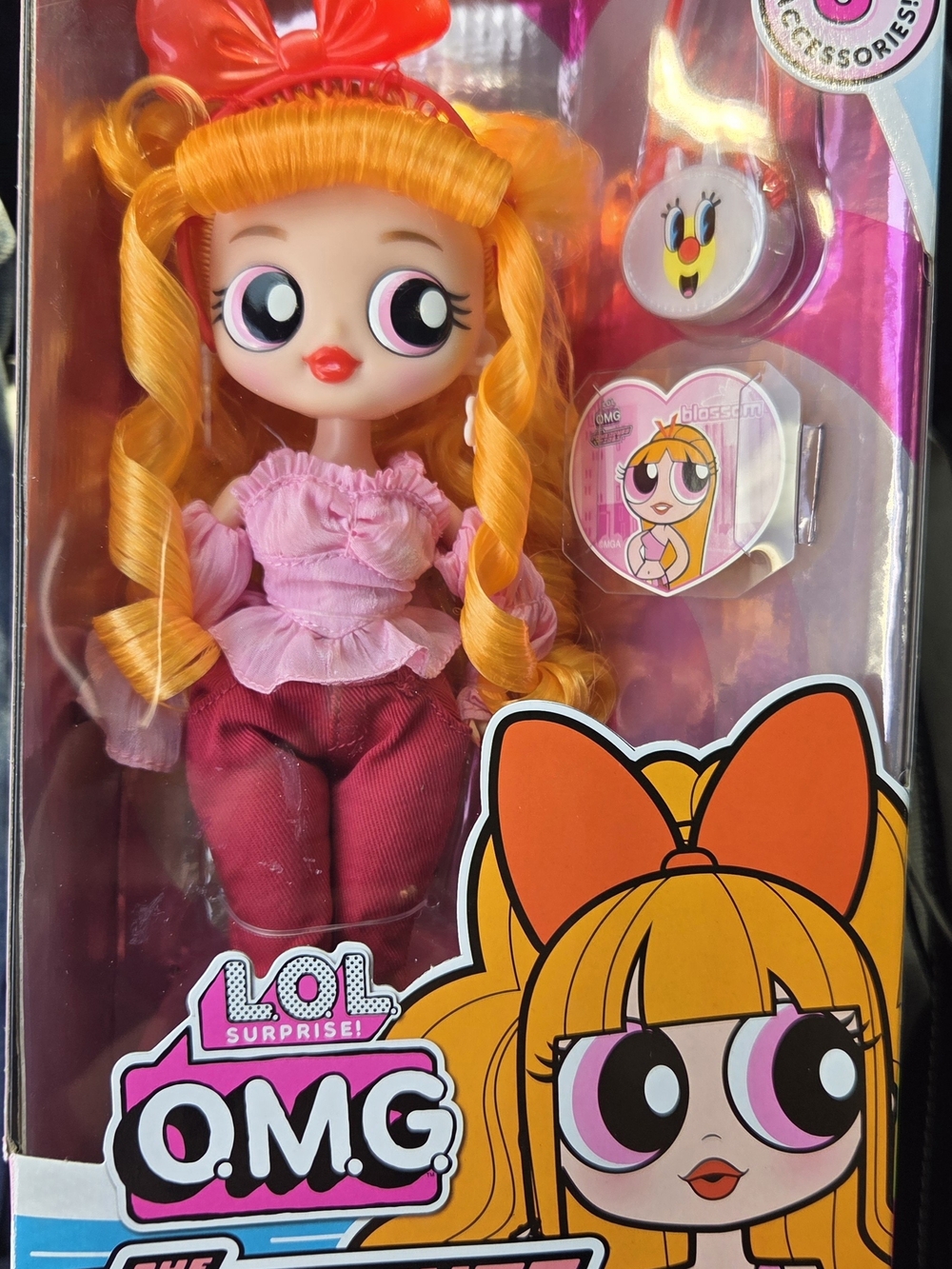 L.O.L. Surprise! doll with bright orange hair and pink outfit